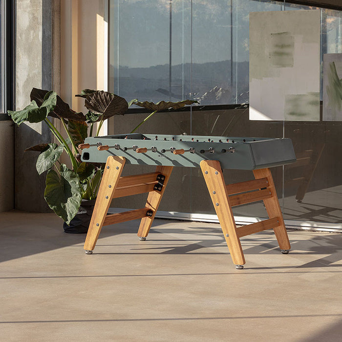 RS Barcelona RS3 Wood football table in a modern living space with plants and natural light showcasing contemporary foosball table design.