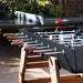 RS Barcelona RS3 Wood football table on a modern outdoor terrace with wooden legs, metal rods and ergonomic handles, creating a stylish outdoor foosball game area.