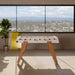 White edition RS Barcelona RS3 Wood football table standing in a bright modern interior with panoramic windows and wooden legs.