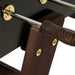 Close-up of RS Barcelona RS3 Wood Gold football table showing dark wooden handles, polished steel rods and brass fittings on a premium designer table football frame.
