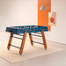 RS Barcelona RS4 Home football table in blue with solid wooden legs, modern designer foosball table in a contemporary interior.