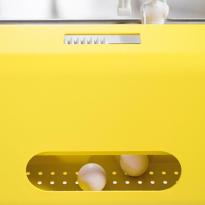 Close-up of RS Barcelona RS4 Home football table in yellow showing goal and ball return detail, modern designer foosball table.