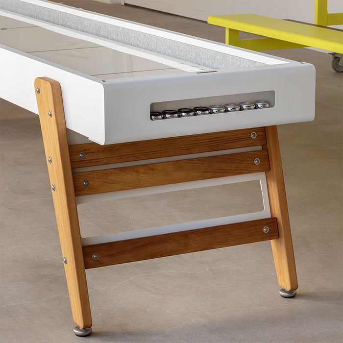 Close-up of RS Barcelona Track shuffleboard table with branded plate and integrated metal puck holder.