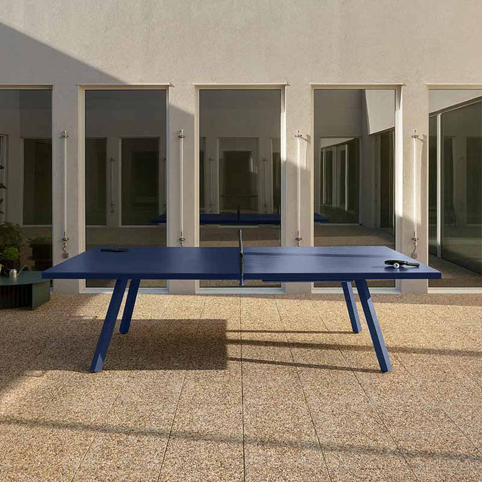 RS Barcelona You and Me monochrome ping pong table in red finish, sleek outdoor table tennis table with modern minimalist design and architectural surroundings.