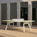 RS Barcelona You and Me monochrome ping pong table in vibrant red with integrated net, modern outdoor table tennis table in clean architectural environment.