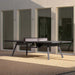 RS Barcelona You and Me monochrome ping pong table in orange finish, contemporary outdoor table tennis table with integrated net in modern courtyard setting.