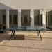 RS Barcelona You and Me monochrome ping pong table in teal green with paddles, contemporary outdoor table tennis table in sleek modern courtyard environment.