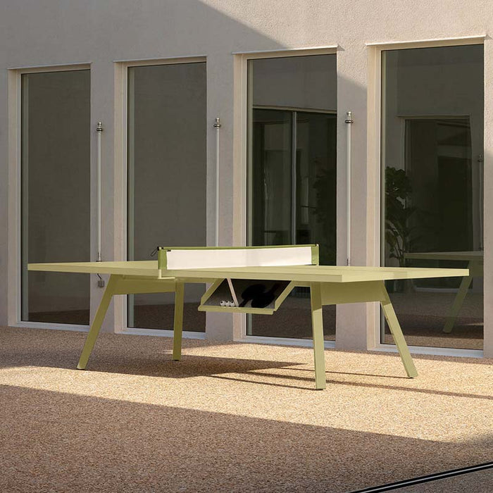 RS Barcelona You and Me monochrome ping pong table in dark red with paddles, sleek outdoor table tennis table in contemporary architectural courtyard setting.