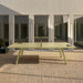 RS Barcelona You and Me monochrome ping pong table in black finish with integrated net, modern outdoor table tennis table in minimalist architectural courtyard.