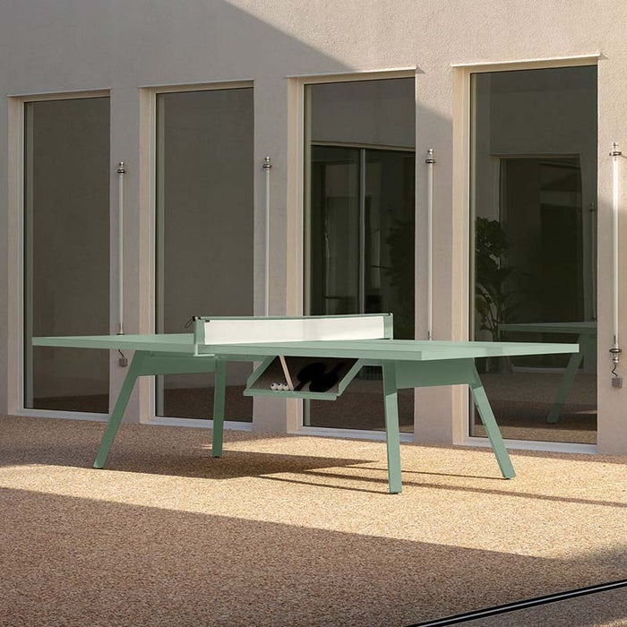 RS Barcelona You and Me monochrome ping pong table in black with paddles, sleek outdoor table tennis table with clean lines in contemporary courtyard setting.