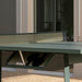 RS Barcelona You and Me monochrome ping pong table in charcoal black finish, contemporary outdoor table tennis table in minimalist courtyard with architectural backdrop.