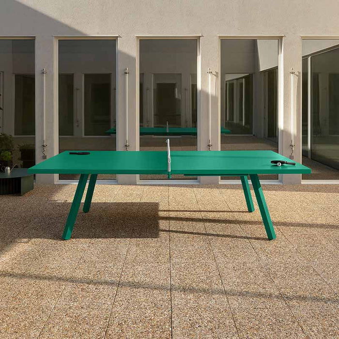RS Barcelona You and Me monochrome ping pong table in pale green with paddles, contemporary outdoor table tennis table in minimalist courtyard setting.
