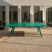 RS Barcelona You and Me monochrome ping pong table in pale green with paddles, contemporary outdoor table tennis table in minimalist courtyard setting.