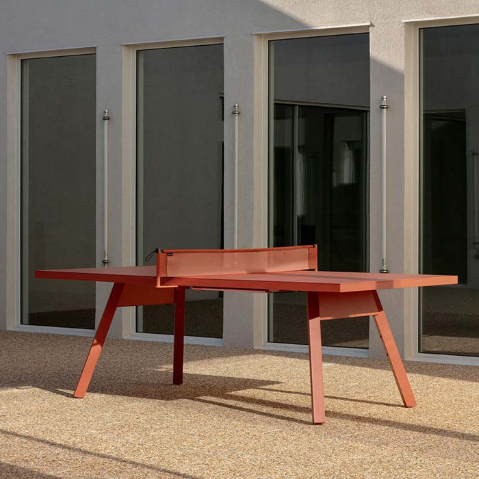 RS Barcelona You and Me monochrome ping pong table close-up showing storage tray with paddles and balls, modern outdoor table tennis table detail design.