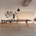Modern interior with RS Barcelona You and Me ping pong table in white and black, sleek table tennis table with integrated storage and wooden legs