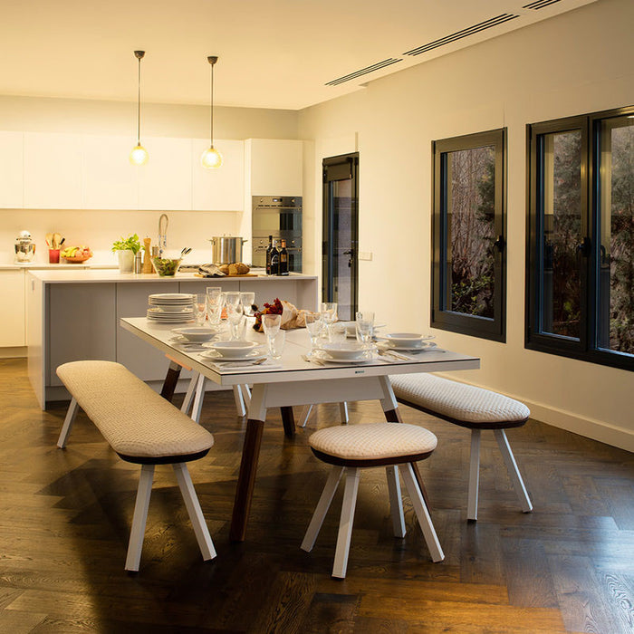 Elegant dining setup featuring RS Barcelona You and Me ping pong table in white, multifunctional table tennis dining table with wooden legs in modern kitchen interior