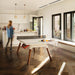 Bright kitchen space with RS Barcelona You and Me ping pong table in white, multifunctional dining and table tennis table with wooden legs