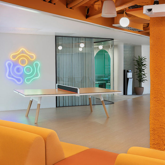 Contemporary office space featuring RS Barcelona You and Me ping pong table in white with wooden legs, multifunctional table tennis table in stylish interior setting