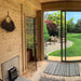 Cosy interior of Traditional Sauna Cube  with wooden walls, a sliding door leading to a garden, and comfortable seating.