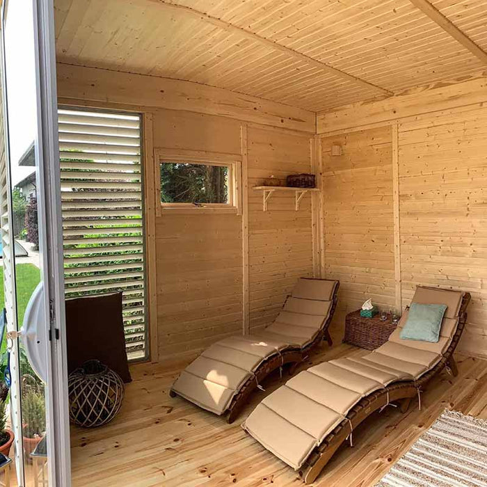 The sauna area with wooden benches, a window, and a stove for a traditional sauna experience.