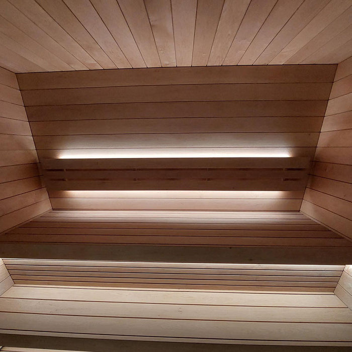 Detailed view of the spacious wooden interior of the Saunum AirCube One Outdoor Sauna, with integrated lighting creating a warm, relaxing atmosphere.