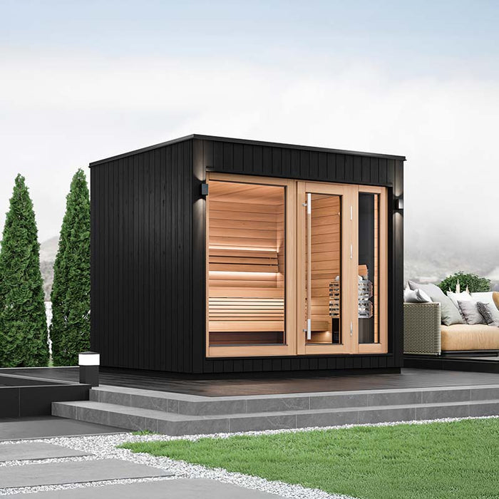 Elegant black-panelled Saunum AirCube One Outdoor Sauna positioned in a contemporary garden setting, showcasing its sleek design and large glass front doors.