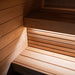 View of the lower bench in the Saunum Classic Mini Outdoor Sauna, made from Thermo-Aspen wood, softly lit with LED lighting to create a tranquil sauna space.