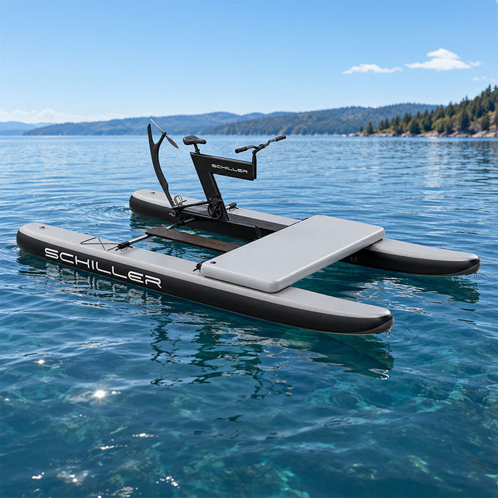 Schiller S1-C Water Bike floating on a calm lake with a mountain view.