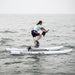 Rider pedalling a Schiller S1-C Water Bike across open water.