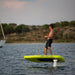 Rider gliding across the water on the yellow SiFly Lite eFoil Set.