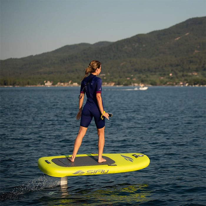 Woman using the yellow SiFly Lite eFoil Set on the water.