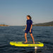 Woman riding the yellow SiFly Lite eFoil Set across the water.