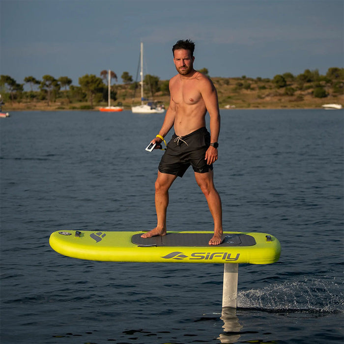 Yellow SiFly Lite eFoil Set shown with its inflatable board and hydrofoil.