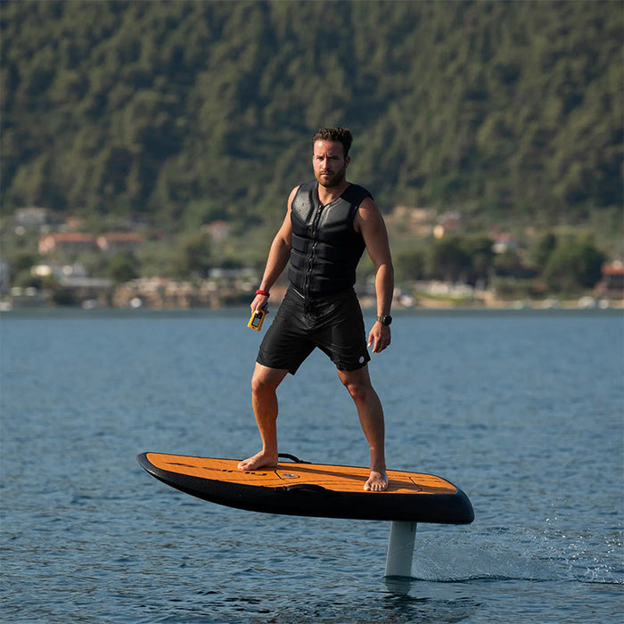Rider using the SiFly Rider eFoil Set while gliding across a lake.