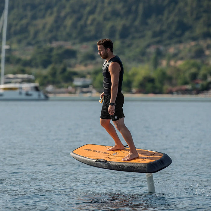 SiFly Rider eFoil Set with a rider standing above the water.