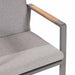 Close-up of the armrest of a chair from the Stockholm 6 Seater Outdoor Dining Set, showcasing the teak wood detail against the grey frame.