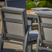 Close-up view of chairs next to the Stockholm Outdoor Dining Set.