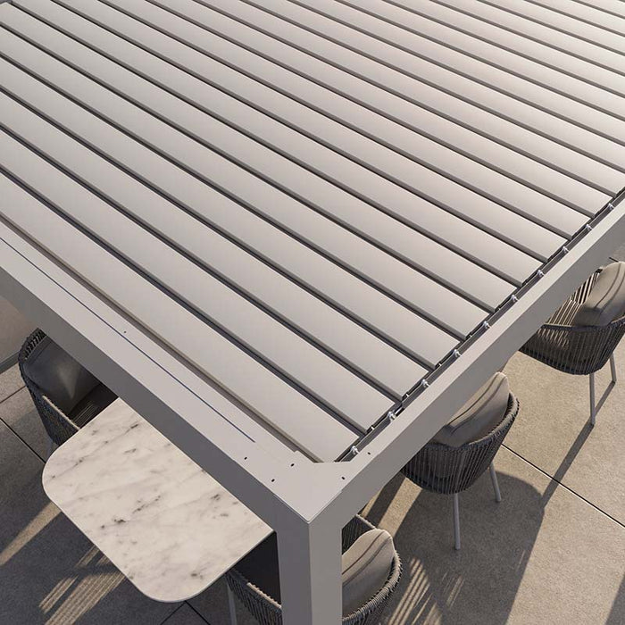 Overhead view of the Suns Lifestyle Luxe Electric Louvered Pergola, showcasing its sleek, adjustable louvres providing shade for an outdoor dining table.