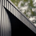 Close-up of the exterior vertical black timber cladding on the Tauras Classic sauna with hot tub, emphasising premium outdoor sauna construction.