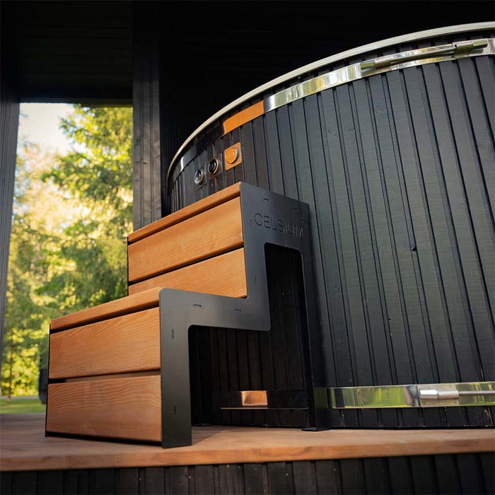 Front view of the Celsium access step leading into the hot tub, highlighting the clean design and craftsmanship of the Tauras Classic outdoor spa.