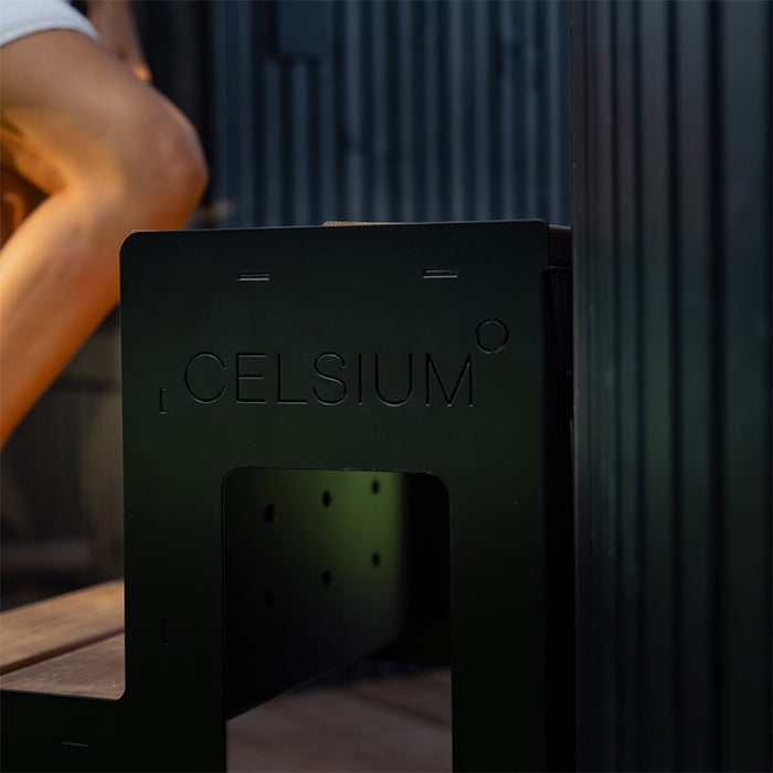 Close-up of the Celsium branded steps leading into the hot tub of the Tauras Classic outdoor sauna unit, merging design with functionality.