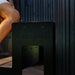 Close-up of the Celsium branded steps leading into the hot tub of the Tauras Classic outdoor sauna unit, merging design with functionality.