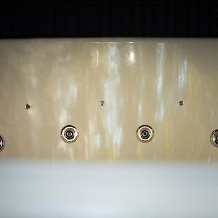 Close-up of the hydrotherapy massage jets inside the Tauras Classic 7-person hot tub, offering powerful water circulation and a spa-quality soak.