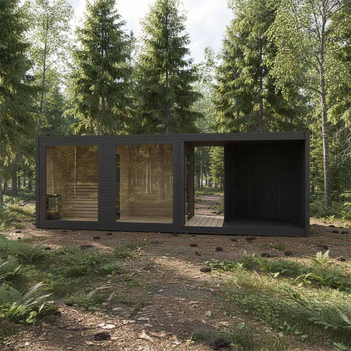 Modern black Tauras Balance 12-person modular sauna cabin positioned in a serene forest environment, showcasing glass panels and wood interiors.