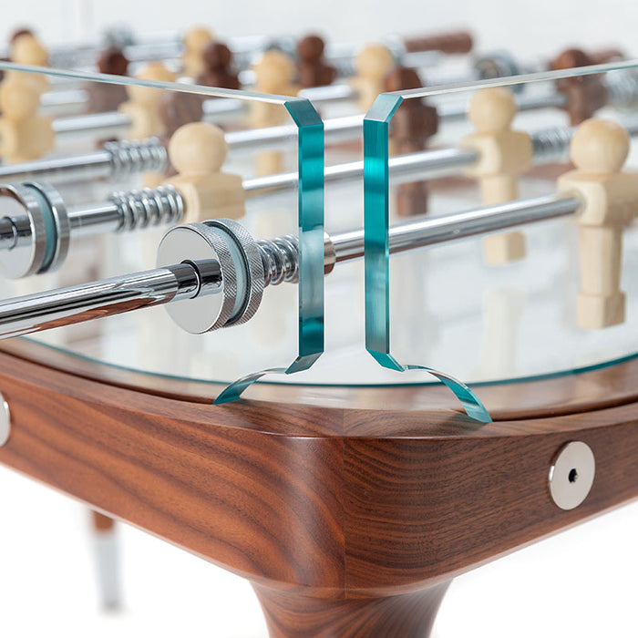 A close-up of the sturdy walnut wood frame of the Teckell 90 Minuto Wood Foosball Table - III Noce Italiano, showcasing the elegant craftsmanship.