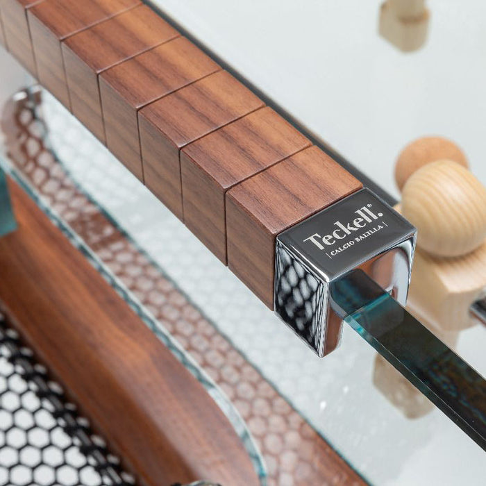 Close-up of the polished walnut wood handle with the Teckell logo on the Teckell 90 Minuto Wood Foosball Table - III Noce Italiano.