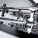 Close-up shot of the chrome-plated handles and rods, showcasing the precision engineering of the Teckell Cristallino Black Foosball Table.