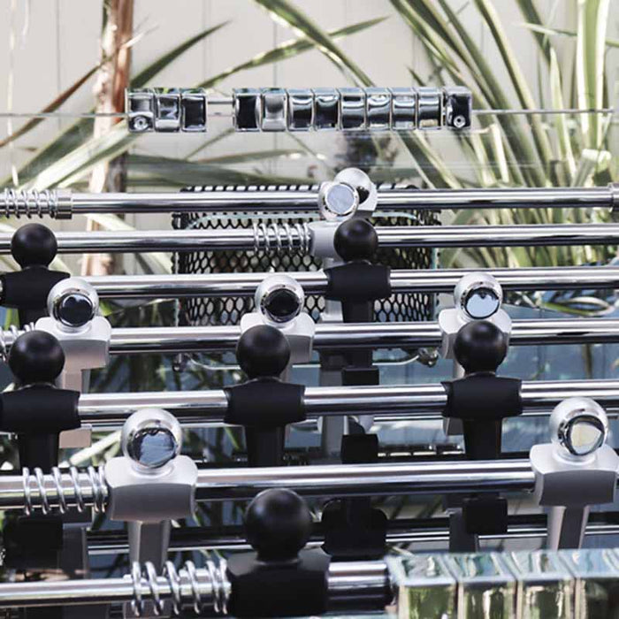 Overhead view of the playing field with chrome rods and players on the Teckell Cristallino Black Foosball Table.