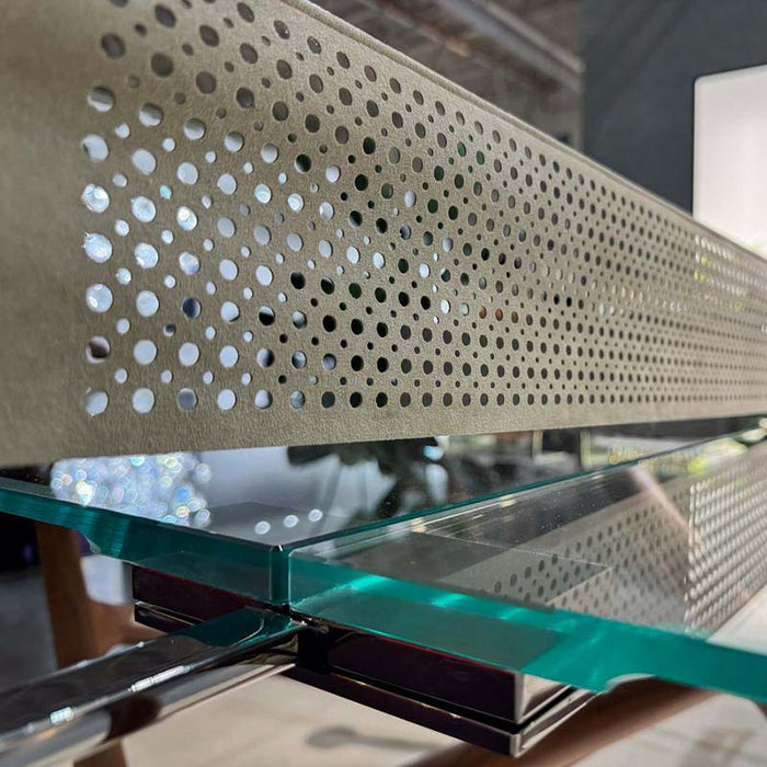 A detailed close-up of the Alcantara net on the Teckell Effetto 71 Table Tennis Table, highlighting the perforated texture and sleek design integration with the glass surface.