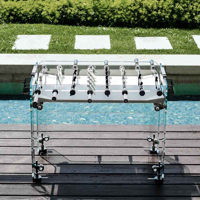 Teckell Fuoriclasse Foosball Table by the poolside, highlighting its luxurious and transparent design.